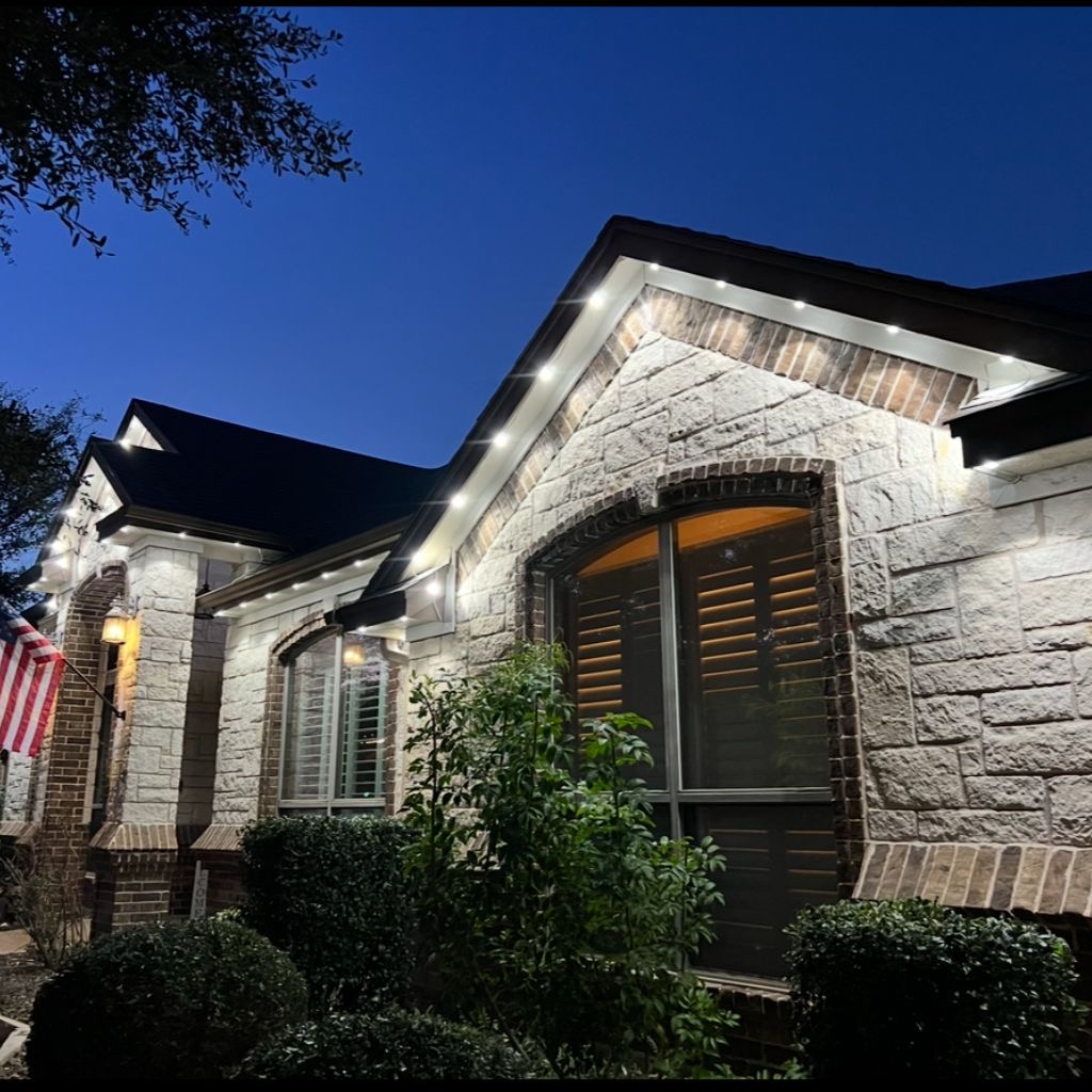 Permanent blue and white roofline lighting installation on Kansas City home 6