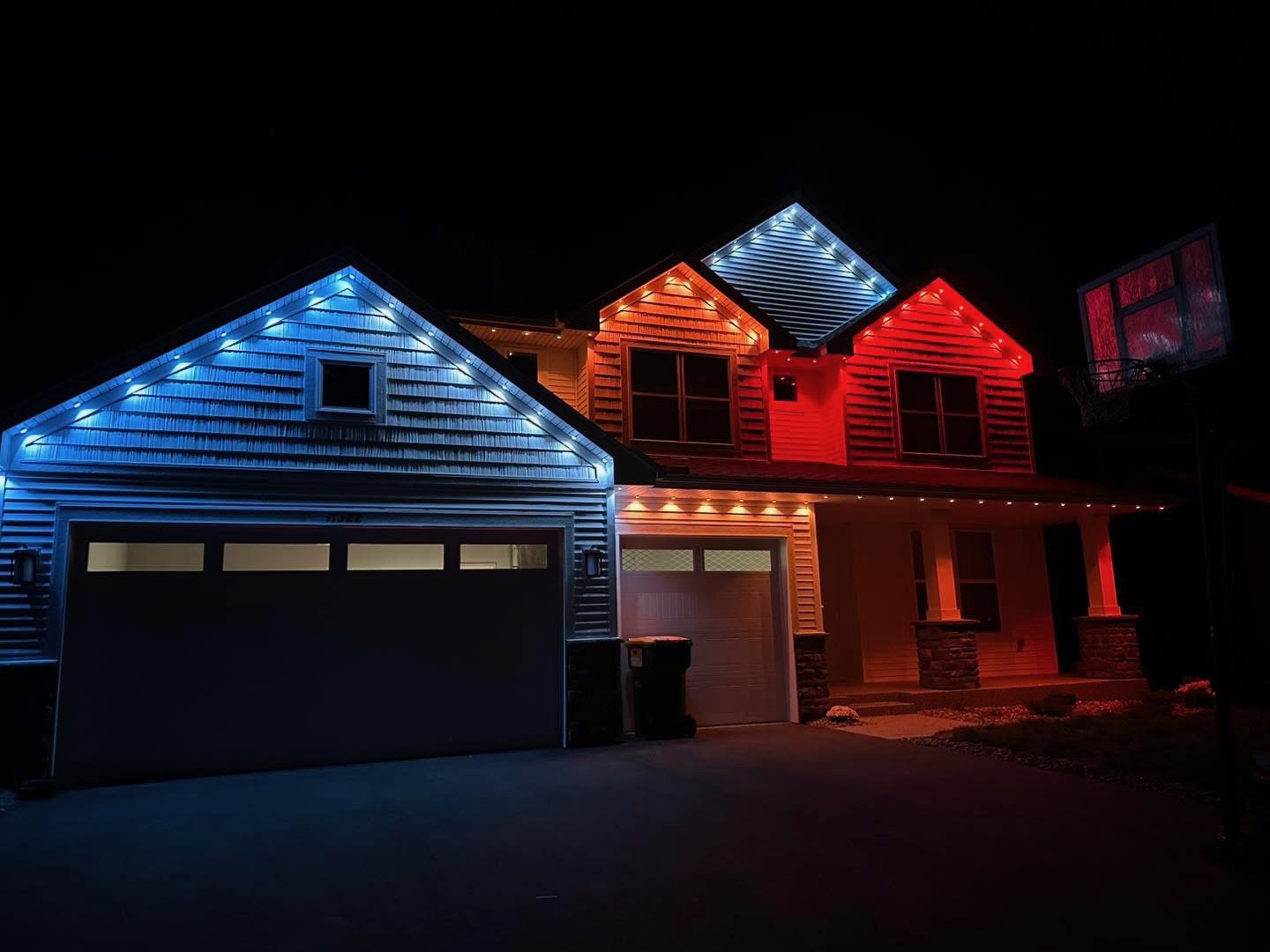 Permanent blue and white roofline lighting installation on Kansas City home 2