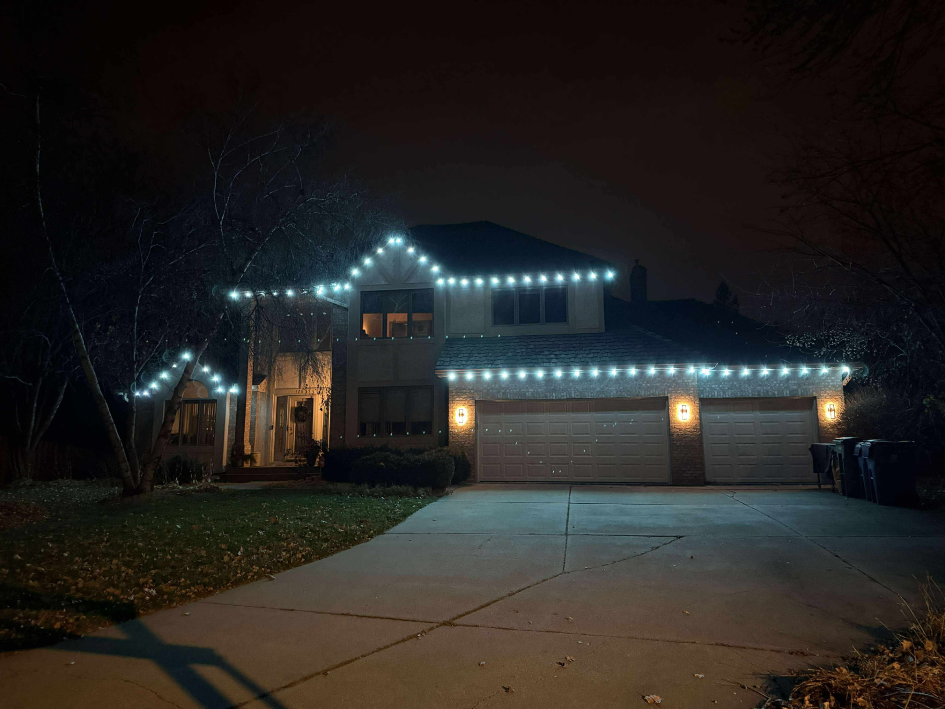 Permanent blue and white roofline lighting installation on Kansas City home 5