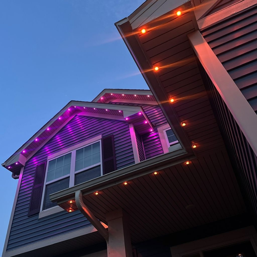Permanent blue and white roofline lighting installation on Kansas City home 1